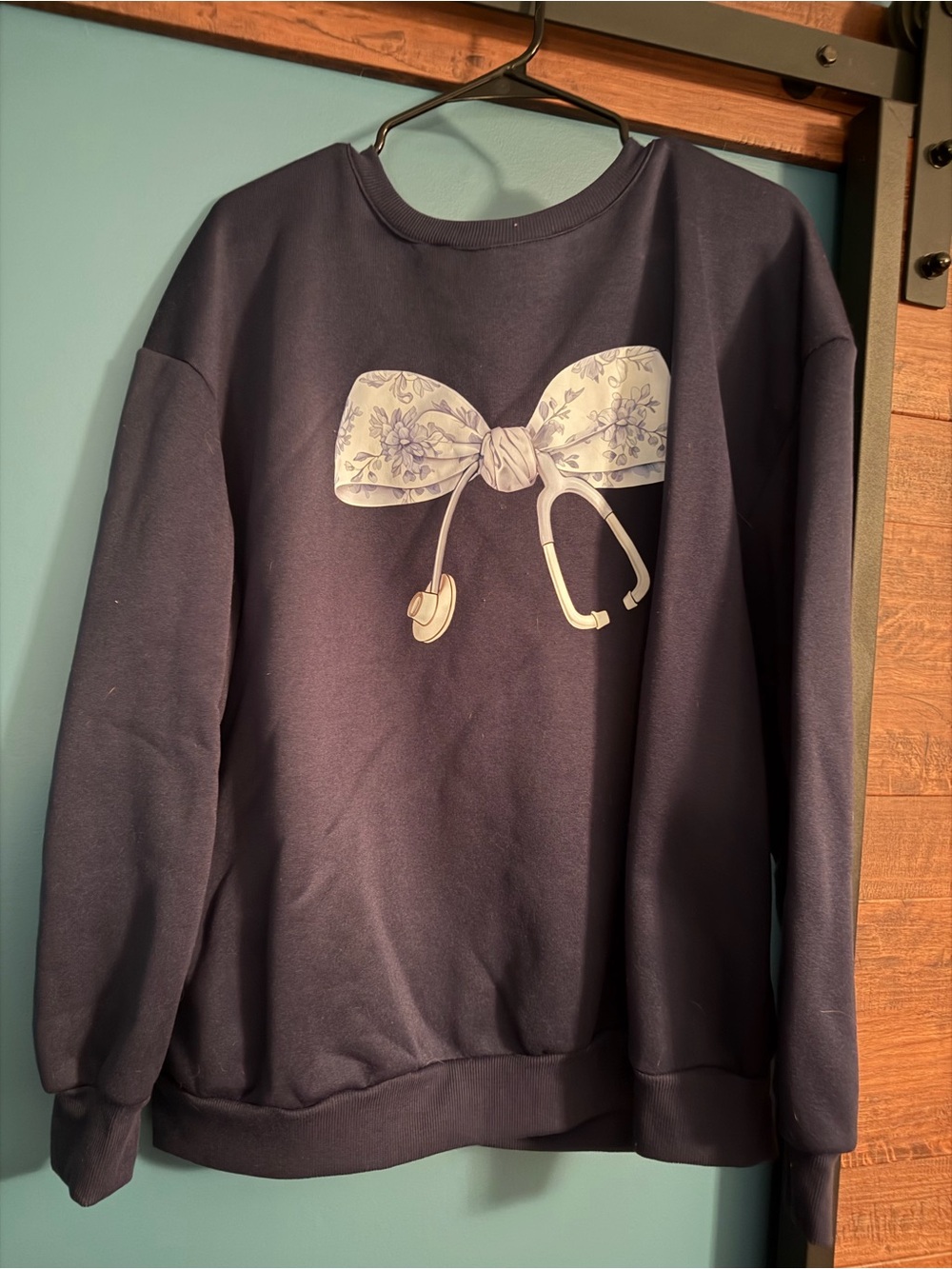Navy Women’s Crewneck Sweatshirt with Floral Bow stethoscope Graphic